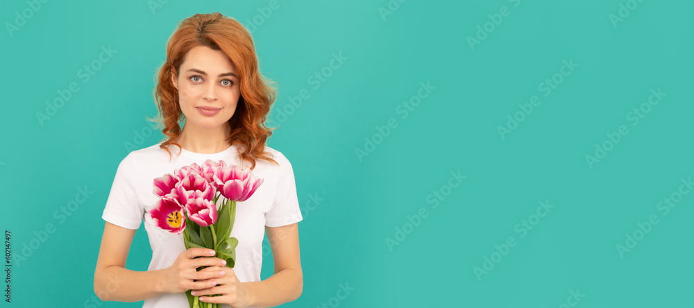 Woman isolated face portrait, banner with mock up copyspace. girl with tulip flower bouquet on blue background. Woman isolated face portrait, banner with mock up copyspace. girl with tulip flower bouquet on blue background.