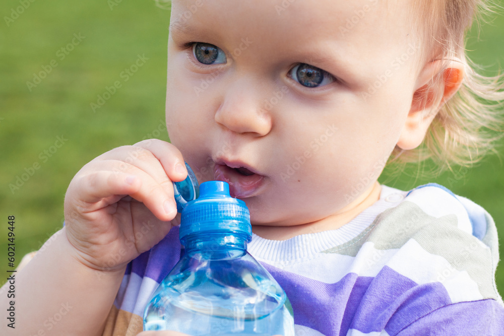 Cute little boy drinking water from bottle Cute little boy drinking water from bottle