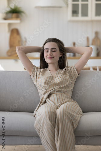 Happy serene pretty adult girl relaxing on sofa with closed eyes, breathing fresh air with indoors, leaning on back with arms on nap, enjoying leisure, relaxation, pause, success, meditation Free Download Happy serene pretty adult girl relaxing on sofa with closed eyes, breathing fresh air with indoors, leaning on back with arms on nap, enjoying leisure, relaxation, pause, success, meditation - GFXLoad