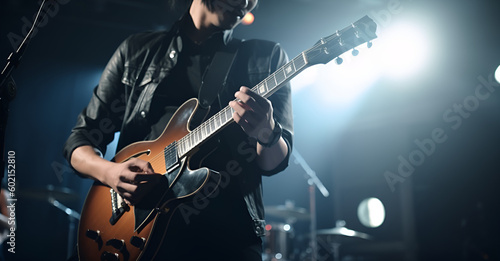 Guitarist on stage with microphone for background, soft and blur concept 
