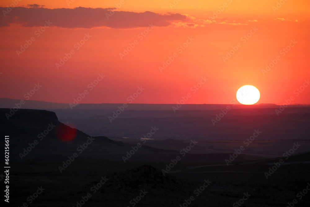 Colorful sunset over the mountains on a clear day Colorful sunset over the mountains on a clear day