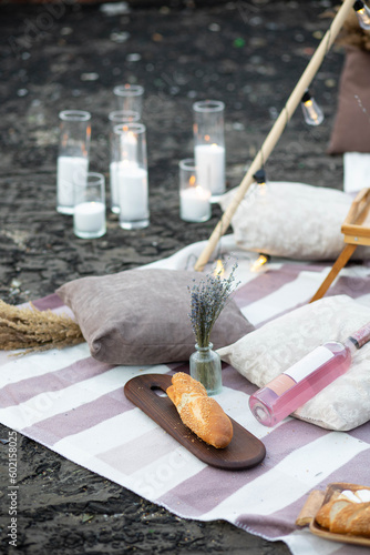 Romantic picnic with wine, cheese, lavender, strawberry