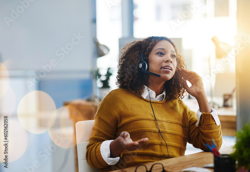 Talking, crm or woman in call center consulting, speaking or explaining at customer services. Virtual assistant, contact us or biracial sales consultant in telemarketing or telecom company help desk photo