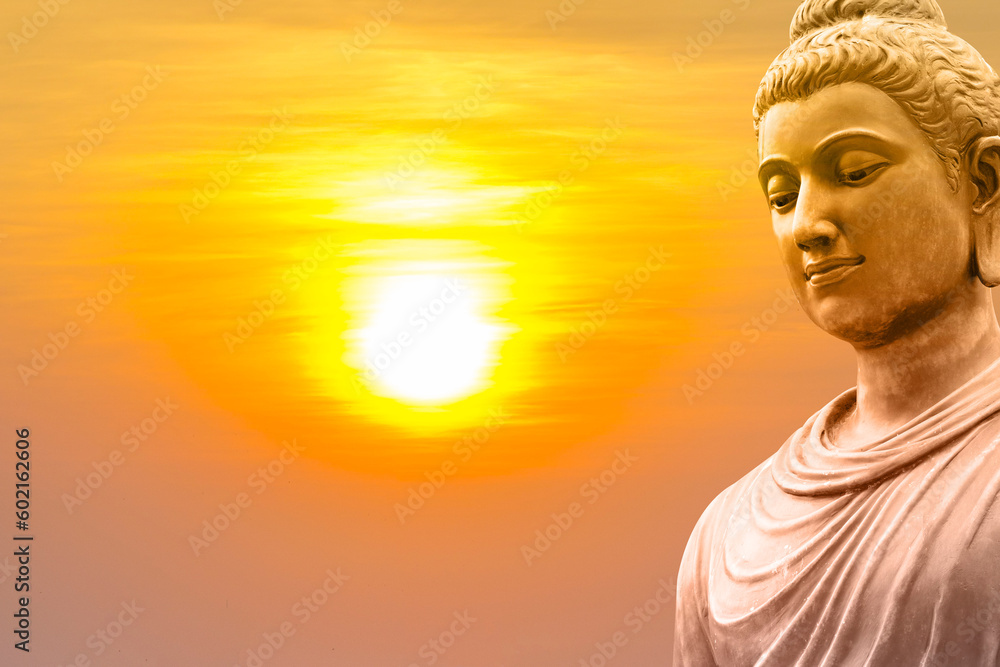Buddha face on sunset background. Buddha face on sunset background.