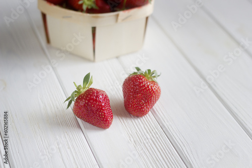 Strawberries on white wooden background