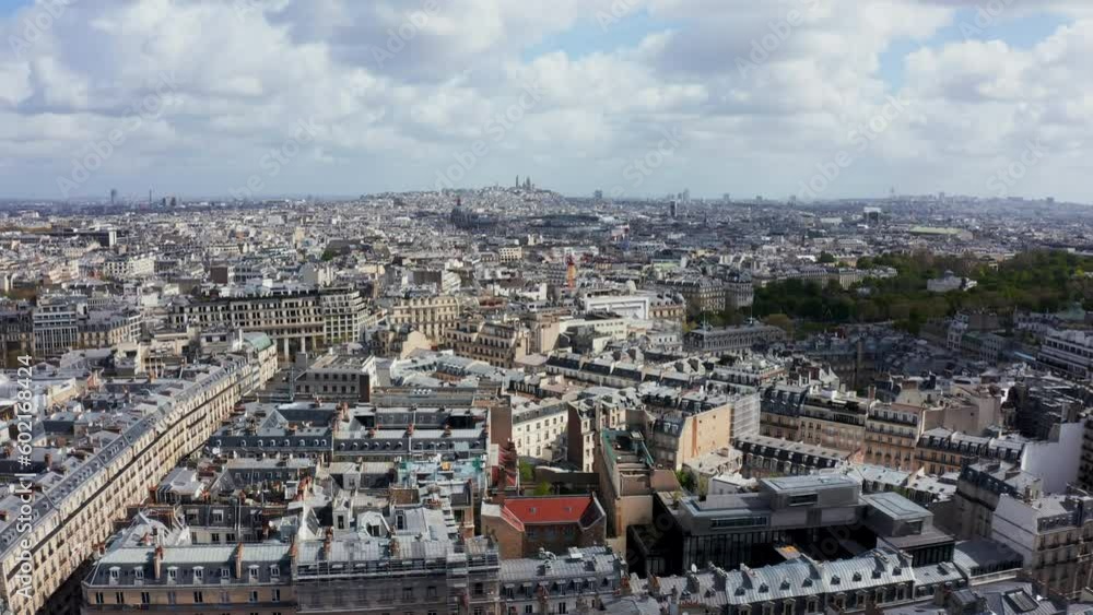 Flying above Paris rooftops on sunny day, urban grid, France Flying above Paris rooftops on sunny day, urban grid, France