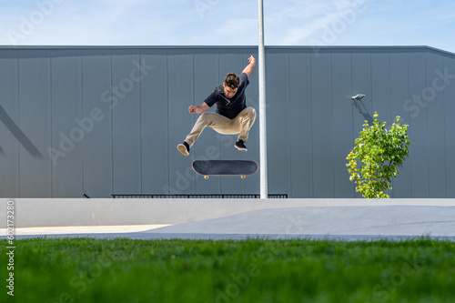 Skateboarder doing a flip trick © homydesign