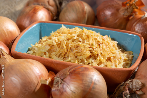 Dried yellow frakes of onion, asian cuisine, close up photo