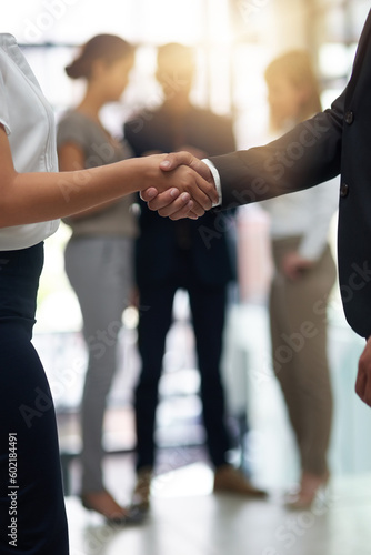Bussiness people, shaking hands and partnership deal at meeting for networking, b2b and success. Professional man and woman together for handshake, corporate partner and introduction or agreement photo