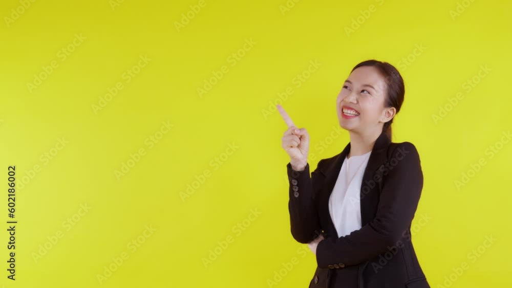 Portrait happy young asian business woman presenting isolated on yellow background, advertising and marketing, executive and manager, businesswoman confident showing and talking with expression. Portrait happy young asian business woman presenting isolated on yellow background, advertising and marketing, executive and manager, businesswoman confident showing and talking with expression.