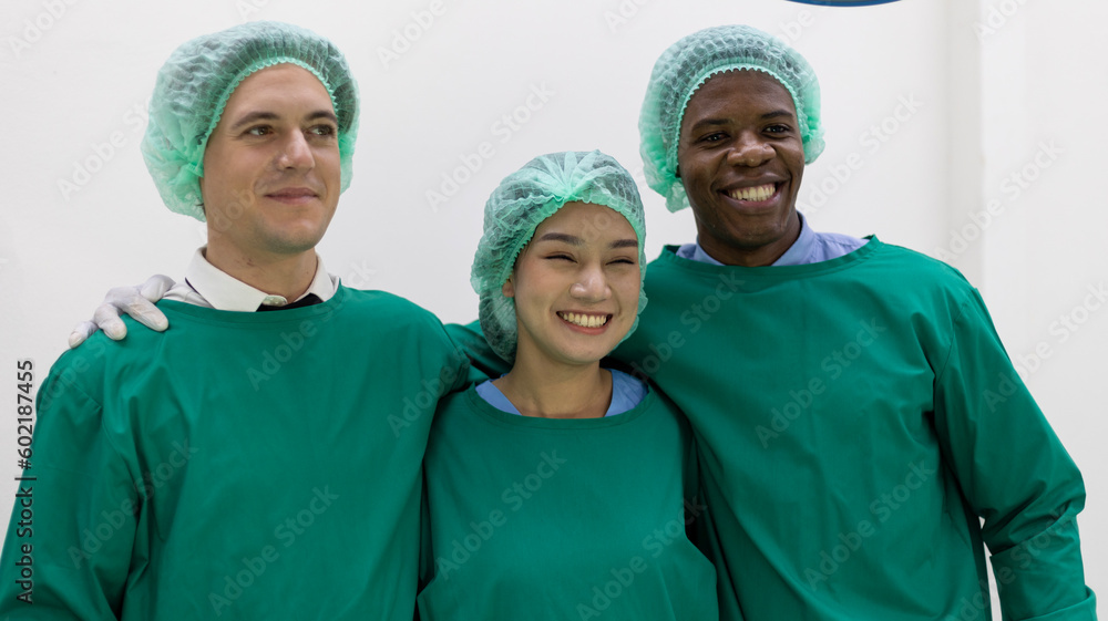Team of medical doctors or surgeons from different nationalities stand with confident to provide health care service to patient in a surgery room Team of medical doctors or surgeons from different nationalities stand with confident to provide health care service to patient in a surgery room