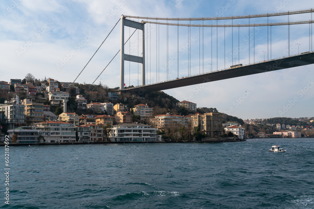View of Sultan Mehmed Fatih Bridge and the embankment of the European part of Istanbul from the water area of the Bosphorus on a sunny day, Istanbul, Turkey View of Sultan Mehmed Fatih Bridge and the embankment of the European part of Istanbul from the water area of the Bosphorus on a sunny day, Istanbul, Turkey