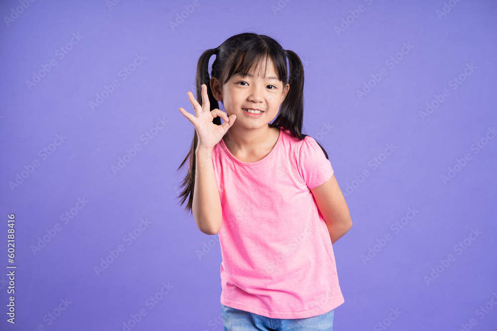 beautiful asian girl portrait posing on purple background beautiful asian girl portrait posing on purple background