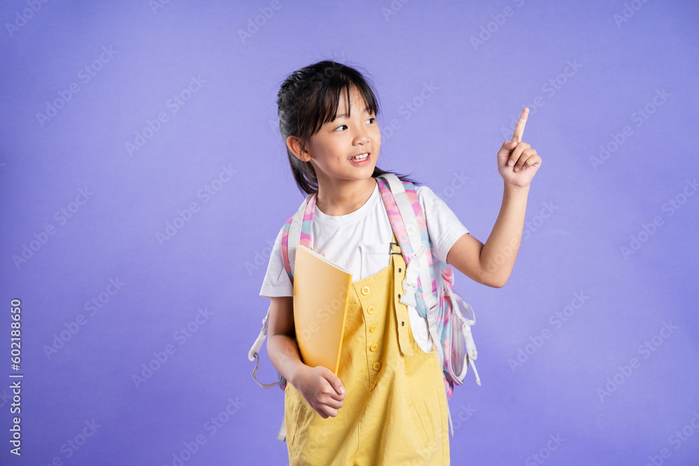 cute asian schoolgirl posing on purple background cute asian schoolgirl posing on purple background
