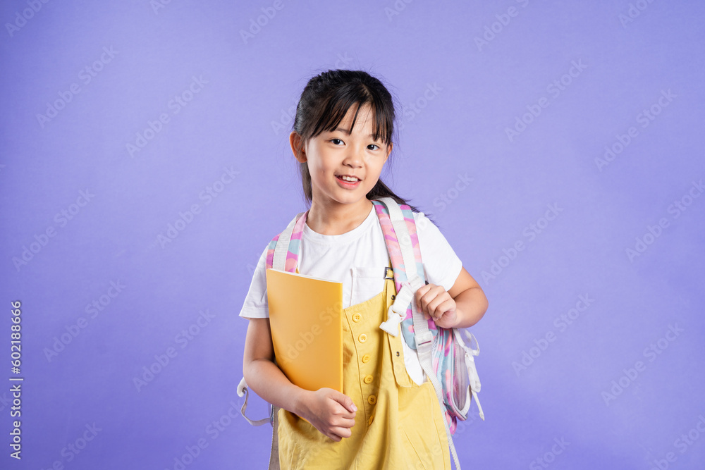 cute asian schoolgirl posing on purple background cute asian schoolgirl posing on purple background