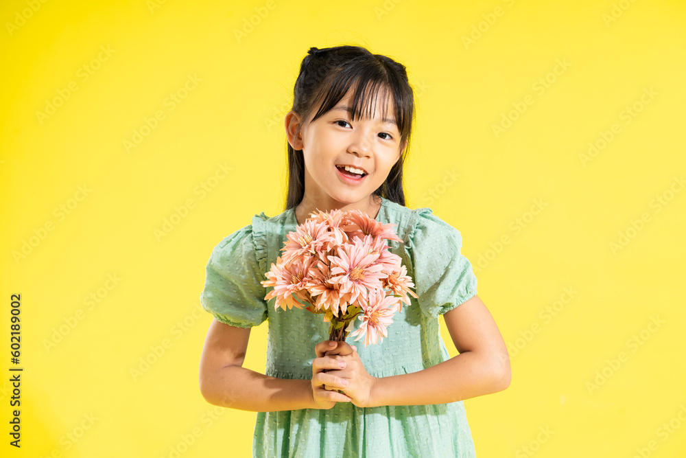 happy smiling asian girl on yellow background happy smiling asian girl on yellow background