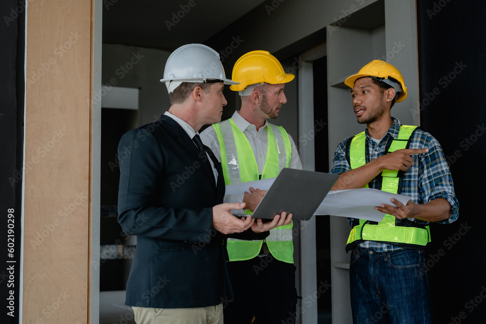 multi ethnic engineer brainstorming and measuring for cost estimating on blueprint and floor plan drawings about design architectural and engineering for houses and buildings multi ethnic engineer brainstorming and measuring for cost estimating on blueprint and floor plan drawings about design architectural and engineering for houses and buildings