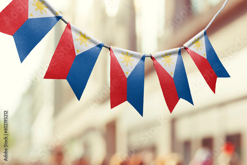 A garland of Philippines national flags on an abstract blurred background
