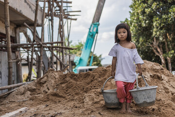 Children working at construction site for world day against child labor concept: