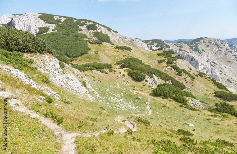 Naklejka premium Hiking to Bobotov Kuk, the highest peak in Montenegro, situated in Durmitor National Park