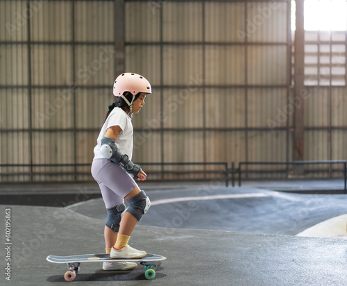 Photography asian child skater or kid girl fun playing skateboard or start ride surf skate i