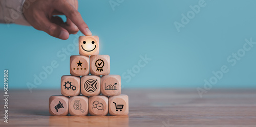 Consumer showing satisfaction rating concept with wooden blocks ,evaluation business success ,Services and Products and Customer Engagement ,Online ratings and reviews ,Quality Assessment
