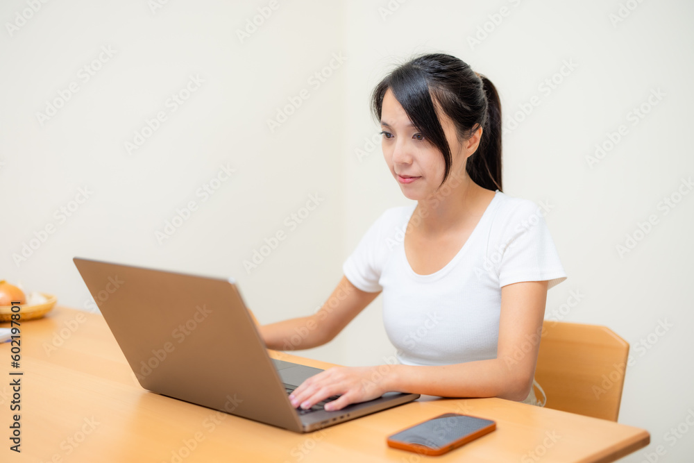 Housewife work on laptop computer Housewife work on laptop computer