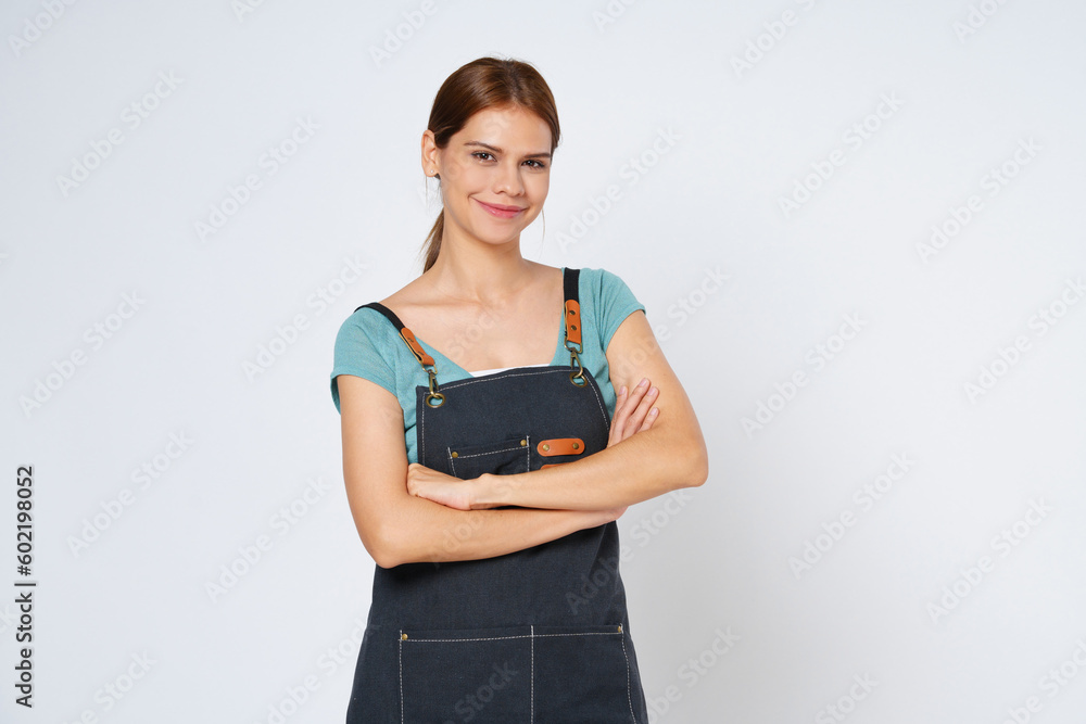Happy woman chef or cook in apron standing isolated over white background. Happy woman chef or cook in apron standing isolated over white background.