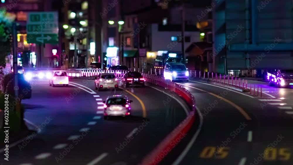 A night timelapse of the miniature traffic jam at the city street panning A night timelapse of the miniature traffic jam at the city street panning
