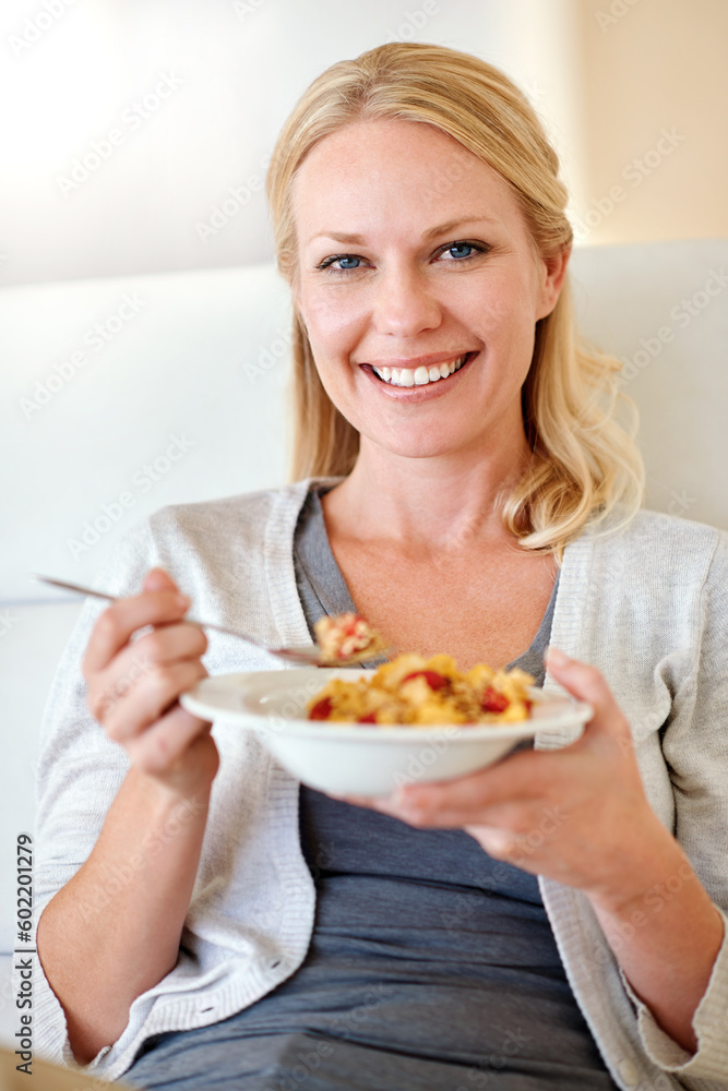 Happy woman, portrait smile and cereal for breakfast, morning meal or healthy diet in living room at home. Female person smiling with food bowl of wheat or corn flakes for health, nutrition or fiber