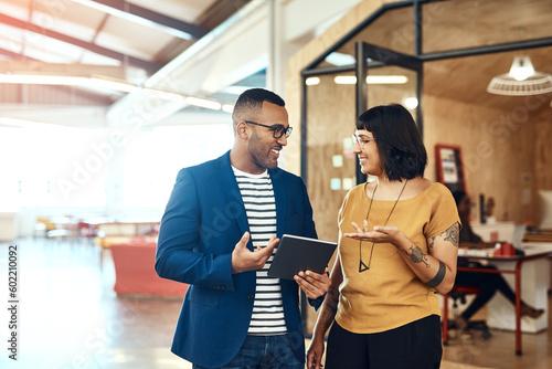 Business people, tablet and a team talking in office with ideas, internet and online motivation. A professional man and woman together for a creative startup project with app for discussion or advice