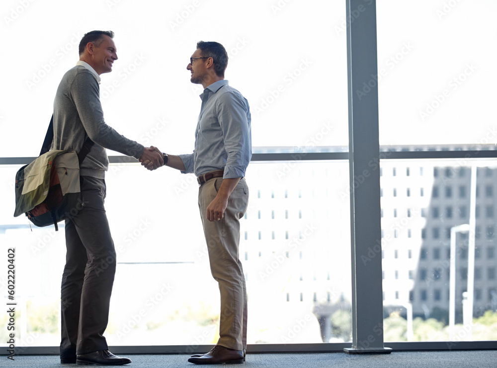 Mature business people, handshake or partnership deal in airport lounge, hotel lobby or modern office for financial crm. Smile, happy or corporate men shaking hands in welcome, thank you or greeting Mature business people, handshake or partnership deal in airport lounge, hotel lobby or modern office for financial crm. Smile, happy or corporate men shaking hands in welcome, thank you or greeting
