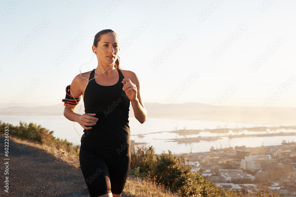 Running, street and woman training, workout and fitness with freedom, view and balance outdoor. Female person, lady and athlete with a healthy lifestyle, runner and exercise with wellness and cardio