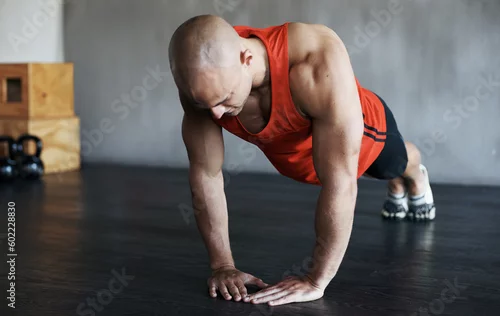Obraz Strong, muscle and man doing strength push up for fitness lifestyle, determination or body fitness commitment. Diamond pushup, power challenge or active person workout, bodybuilding or floor exercise