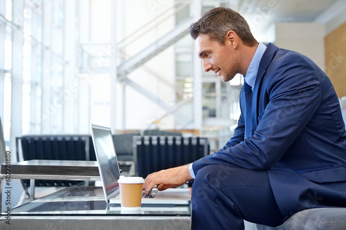 Proposal, email and businessman with a laptop for communication, networking and internet. Business, working and employee reading news, information and corporate chat on a computer with tea in office