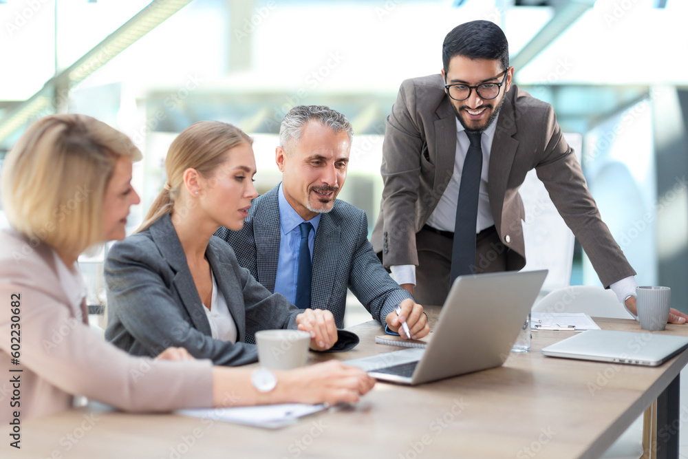 Group of business partners discussing ideas and planning work in office. Group of business partners discussing ideas and planning work in office.