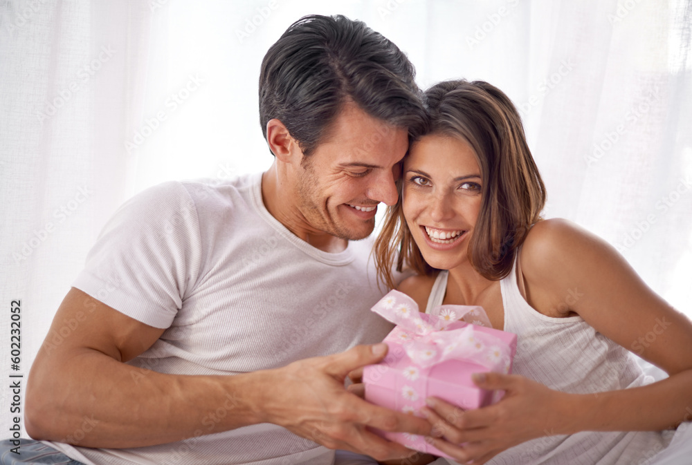 Couple, gift or hug for valentines day portrait celebration with love, care and surprise in bedroom. Man and happy woman in home with box for birthday, holiday or luxury with smile for gratitude Couple, gift or hug for valentines day portrait celebration with love, care and surprise in bedroom. Man and happy woman in home with box for birthday, holiday or luxury with smile for gratitude