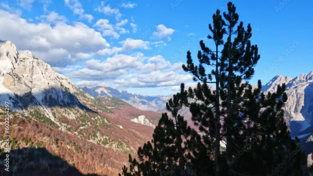 Asian man solo hiking on Valbona Pass trail in Valbona valley, Albania. Asian man solo hiking on Valbona Pass trail in Valbona valley, Albania.