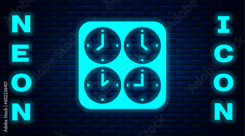 Glowing neon Time zone clocks icon isolated on brick wall background. Vector