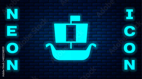 Glowing neon Ancient viking scandinavian drakkar icon isolated on brick wall background. Viking transport ship. Vector