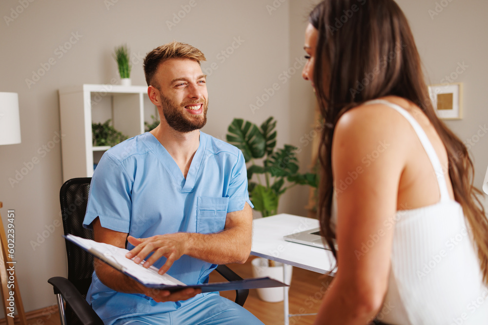 Young woman consults with her doctor Young woman consults with her doctor