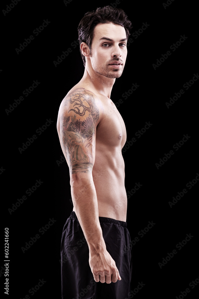 Portrait, man and bare bodybuilder on black background, dark studio and muscular abdomen tattoo. Sexy, serious and strong male model, sports athlete and fitness power for exercise, training or muscle