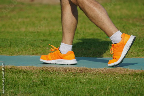 running shoes on grass