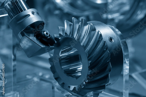 Obraz na plátne Close up  the spiral bevel gear part and the lathe tool in the light blue scene