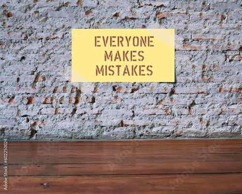 Yellow note stick on wall with red text Everyone Makes Mistakes, concept of learning to forgive yourself, learn lesson from failure and move forward