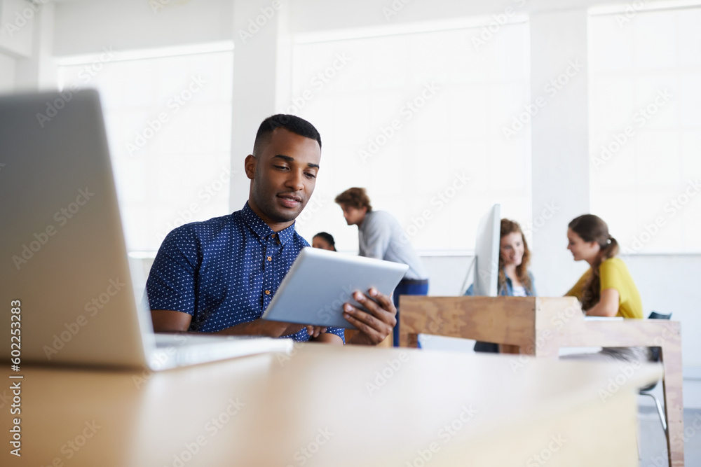 Business, startup or black man reading on tablet working on digital marketing strategy in office. SEO social media content, laptop technology or employee researching online for info on internet site Business, startup or black man reading on tablet working on digital marketing strategy in office. SEO social media content, laptop technology or employee researching online for info on internet site