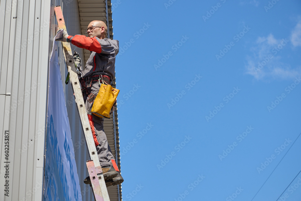custom made wallpaper toronto digitalRope access is a high-risk job. A man works on ropes.