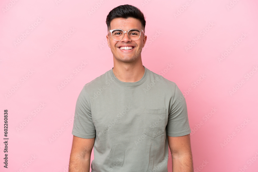 Young caucasian handsome man isolated on pink background laughing Young caucasian handsome man isolated on pink background laughing