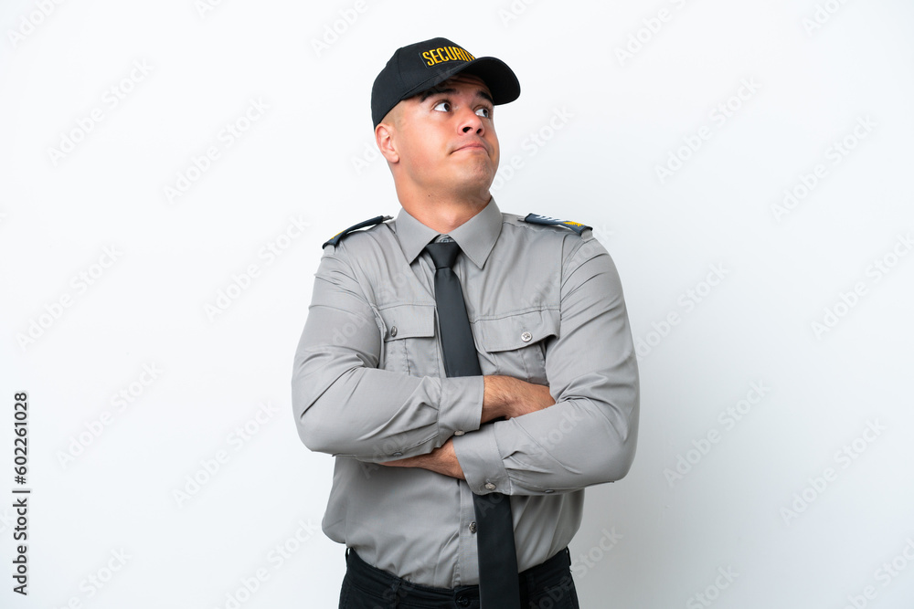 Young caucasian security man isolated on white background making doubts gesture while lifting the shoulders Young caucasian security man isolated on white background making doubts gesture while lifting the shoulders