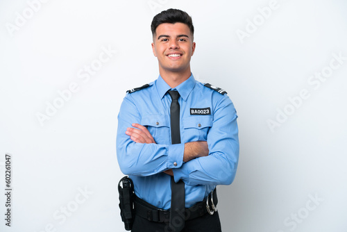 Cuadro en lienzo Young police caucasian man isolated on white background keeping the arms crossed